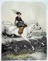 Ein junger Reiter in der Amazonensprung über eine Barriere