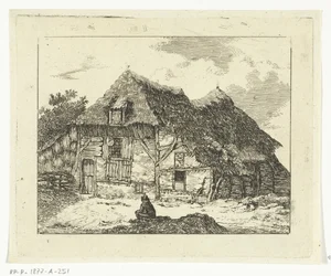 Mann sitzend auf einem Hügel vor einem Haus in Staphorst