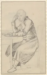 Sitzender Mann an einem Tisch