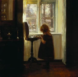 Ein Mädchen, das an einem Nähtisch steht