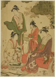 Frauen betrachten Kirschblüten