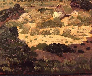 Mädchen, das auf einem sandigen Ufer sitzt