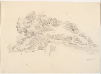 Felsformation mit einem Maler unter einem Sonnenschirm