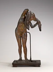 Frau, die ihr Haar arrangiert, möglicherweise späte 1880er-1890er Jahre