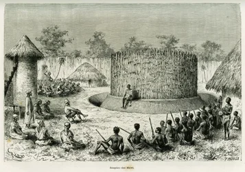 Empfang bei Mkwewe, Stammeshäuptling, mit dem Erzähler. Gravur von Riou zur Illustration der Geschichte „Die Seen des äquatorialen Afrikas“ von Victor Giraud, Schiffsfähnrich, 1883-1885, in Le Tour du monde 1886, unter der Leitung von Edouard Charton (1807