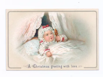 Viktorianische Weihnachtskarte mit einem Kind im Bett, das eine Rassel hält, ca. 1880