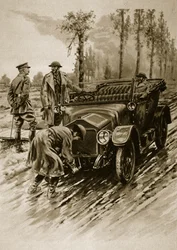 Ein Chauffeur des Frauenhilfskorps der Armee startet den Motor eines Offizierswagens, 1914-19