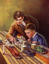 Jungen spielen mit einer Eisenbahn