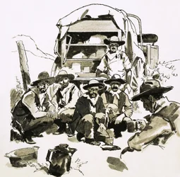 Cowboys versammeln sich um einen Chuck-Wagen