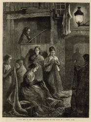 Londoner Leben im East End - Sackherstellung im Licht einer Straßenlaterne