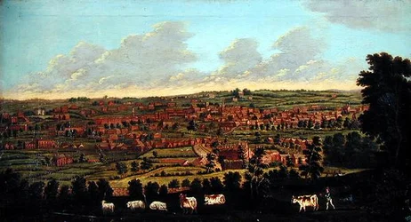 Aussicht auf eine Stadt, mit Vieh und Hirten im Vordergrund