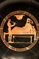 Becher: Symposiast und junger Sklave spielen die Doppelaulos