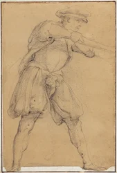 Mann, der mit einer Waffe zielt