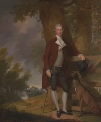 Ein Gentleman und sein Hund in einer Landschaft