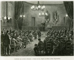 Konferenz für die Arbeiter der Dollfus-Mieg-Werkstätten in Dornach. Gravur von Lix zur Illustration der Geschichte „Durch Elsass und Lothringen“, von Charles Grad, deutscher Abgeordneter, 1885, in Le Tour du monde 1886, unter der Leitung von Edouard Charto