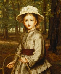 Ein junges Mädchen spielt mit einem Reifen