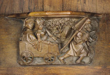 Schnitzerei, die ein Paar in einem von einem Mann gezogenen Wagen darstellt, aus einem Chorgestühl