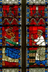 Fenster w15, das eine Szene aus einer Legende von St. Nikolaus darstellt: Das Wunder der 3 Jungen: Ein Metzger tötet drei Jungen