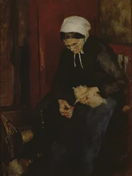 Alte Frau beim Spinnen von Wolle