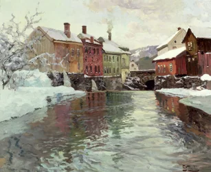 Schneebedeckte Gebäude an einem Fluss