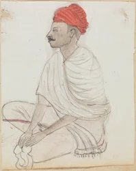 Mann mit rotem Turban, im Schneidersitz