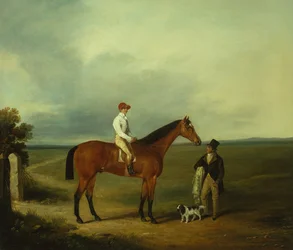 Ein Rennpferd mit Jockey, Trainer und Spaniel