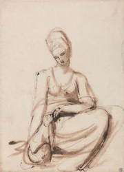 Sitzende Frau, die ein Tier füttert