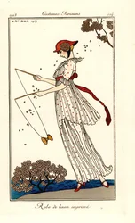 Frau im Kleid aus bedrucktem Leinen, die Diabolo spielt