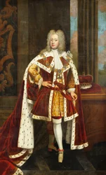 Porträt von König George II. als Prinz von Wales, in voller Länge, in Staatsroben und mit dem Orden des Hosenbandordens, das Schwert in der linken Hand haltend und die Krone auf einem Tisch neben ihm, in einem Innenraum