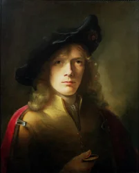 Porträt eines jungen Mannes, der eine Medaille hält