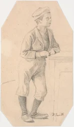 Junge, der sich gegen einen Tisch lehnt