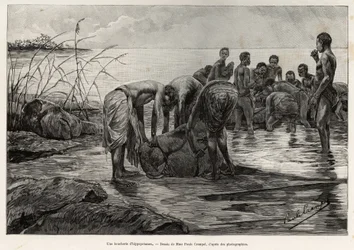 Ein Flusspferd-Schlachthaus am Ufer eines zentralafrikanischen Flusses. Gravur von Henri Thiriat zur Illustration der Geschichte „La mission Crampel“ von Albert Nebout (1862-1939), 1890, in Le tour du Monde 1892, herausgegeben von Edouard Charton (1807-189