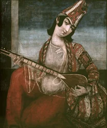 Junge Frau, die Gitarre spielt