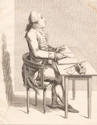 Ein Herr an einem Schreibtisch