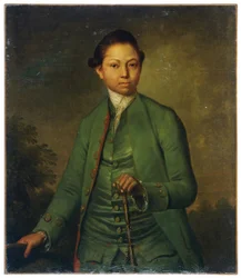 Porträt eines jungen Mannes in grüner Jacke mit Stock