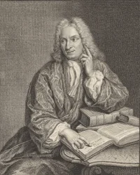 Kniestück von Hendrik Snakenburg, der an einem Tisch sitzt, auf dem einige Bücher liegen