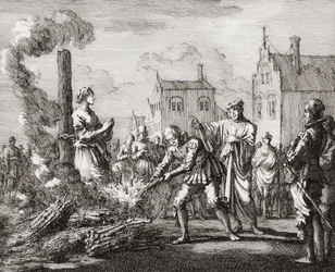 Eine Frau wird als Hexe auf dem Scheiterhaufen verbrannt