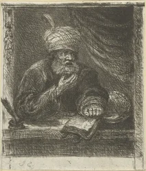 Mann mit Turban hinter einem Schreibtisch