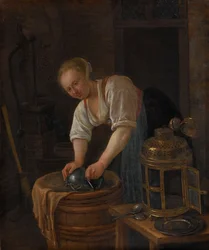 Frau beim Scheuern von Metallwaren