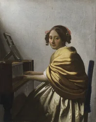 Eine junge Frau, die an einem Virginal sitzt, ca. 1670