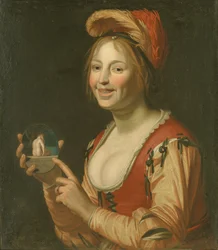 Lachendes Mädchen, das ein kleines Bild einer von hinten gesehenen nackten Frau zeigt
