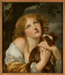 Mädchen mit einem Hund auf dem Arm