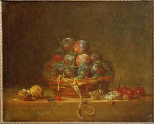 Ein Korb mit Pflaumen, Nüssen, Johannisbeeren und Kirschen