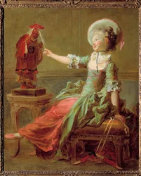 Ein junges Mädchen spielt mit einer chinesischen Statue, die ihr die Haare zieht