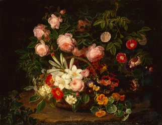 Ein Korb mit Rosen, Lilien und Stiefmütterchen an einem Rosenstrauch