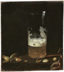 Stilleben mit Bierglas und Nüssen