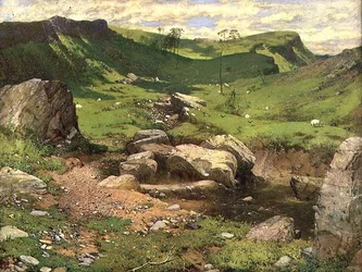 Ein felsiger Bach in einer bergigen Landschaft