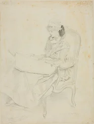 Sitzende junge Frau beim Lesen