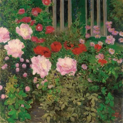 Blühende Blumen am Gartenzaun
