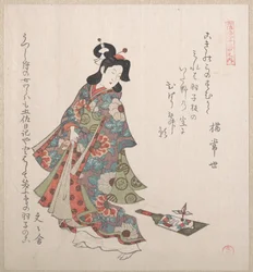 Mädchen mit einem Hagoita (japanischer Federballschläger und Federball)